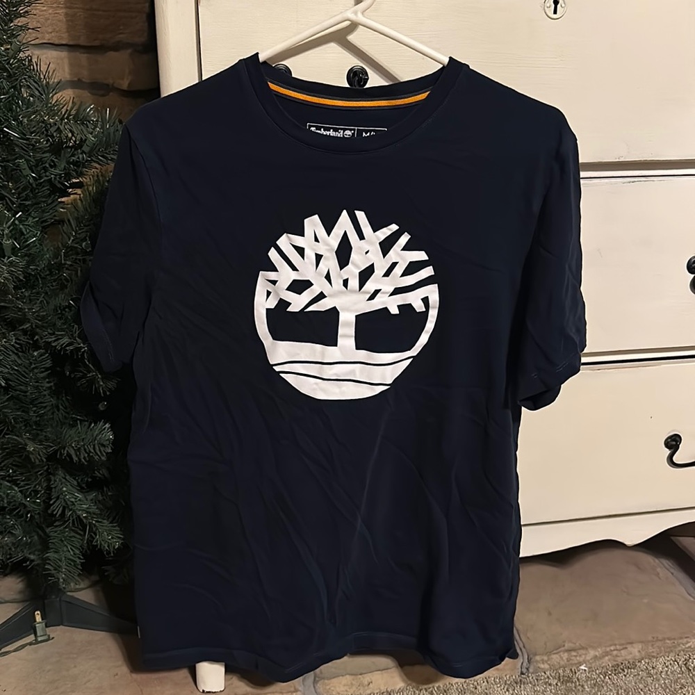Timberland tee size medium. Dark blue color. Smoke free home